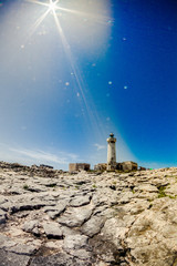 Old lighthouse on the rocks in Capo Murro di Porco near Siracusa - Sicily