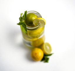lemon and mint on bottle with white background,Refreshing homemade cocktail