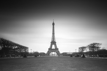 Fototapeta premium Beautiful cityscape view of the Eiffeltower in Paris, France, a popular tourist attraction, in black and white