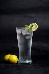 Refreshing homemade cocktail lemon juice,syrup and mint with black backgroung 