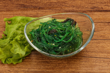 Green Chuka Seaweed Salad Isolated on White Background Top View. Wakame Sea Kelp Salat