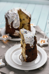 Festive cake for the Easter holiday. Delicious sweet cake. A cake on a table made of light blue boards. Still life on the theme of Easter.