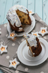 Festive cake for the Easter holiday. Delicious sweet cake. A cake on a table made of light blue boards. Still life on the theme of Easter.