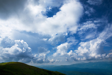 Beautiful sky with clouds and fog over the Carpathians.