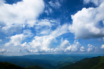 Beautiful sky with clouds and fog over the Carpathians.
