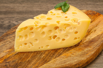 Maasdam cheese - yellow triangle with holes
