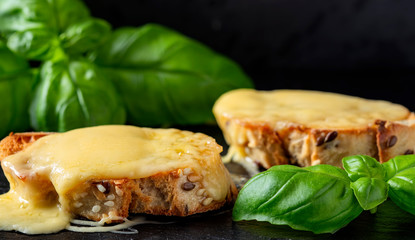 Warm bruschetta with melted cheese