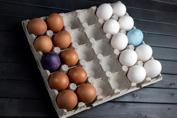 Chicken eggs, white and brown. The eggs are arranged like chess pieces. Chess game with food. Natural product.