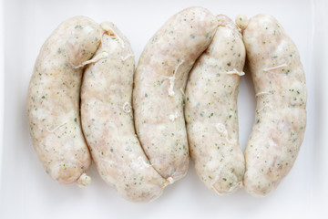 Crude Homemade Chicken Sausage on white background