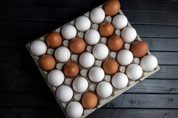 chicken eggs in a cardboard egg tray. White chicken eggs. Agricultural industry. Natural protein.