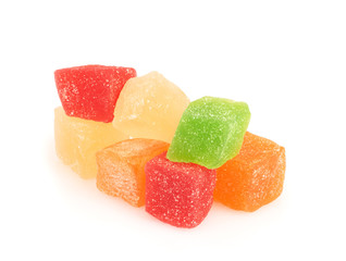 Pile of multi-colored pineapple sweets isolated on white