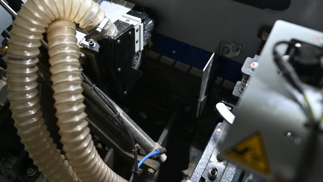 Furniture laminator. Operation of the laminating machine on the sides of furniture boards
