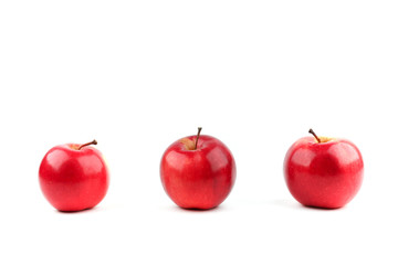 three red apples isolated on white background