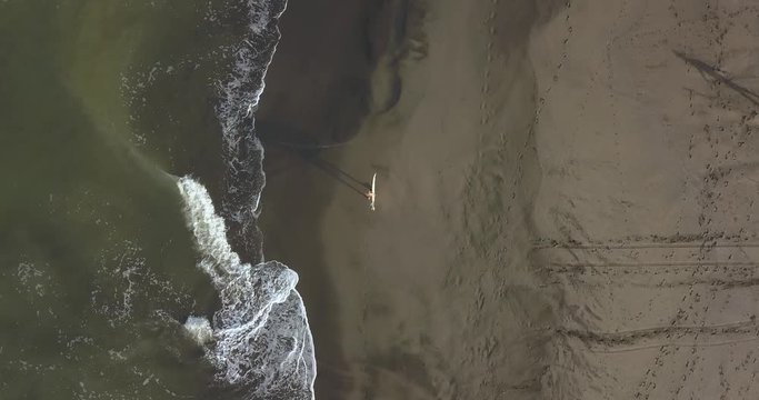 Aerial view of surfer at the beach, Kedungu, Bali, Indonesia