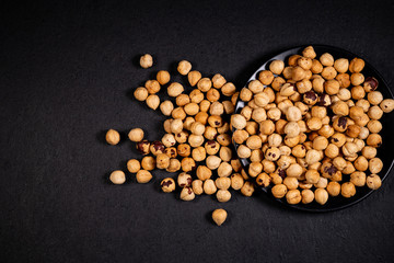 Hazelnut, Hazelnuts on the plate, Roasted hazelnut, hazelnut black background