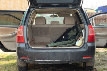 rear car trunk open in black car