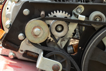 Hand tractor in the garden. A cultivator with a plow makes a furrow in the soil for a potato plantation. walk-behind tractor

