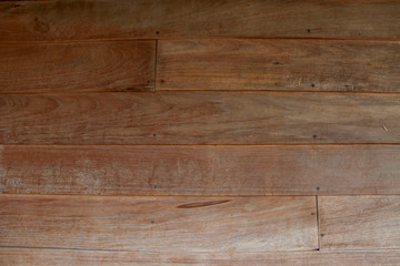 Fototapeta premium Teak wood wall in the house in northern Thailand that are almost a hundred years old. texture and background.