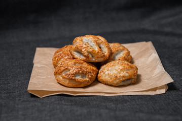Buns from the furnace craft, food paper
Photo on a dark background