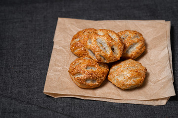 Buns from the furnace craft, food paper
Photo on a dark background
