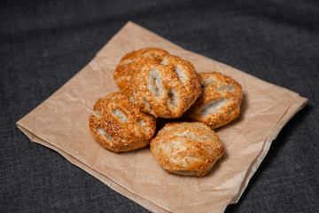 Buns from the furnace craft, food paper
Photo on a dark background