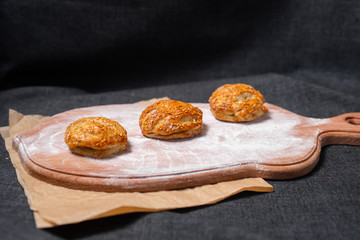 Food on a wooden board.
Baking, rolls, bread, bakery food. Milk in a glass.
Kraft, food paper