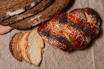 Baking, rolls, bread and milk on a dark background