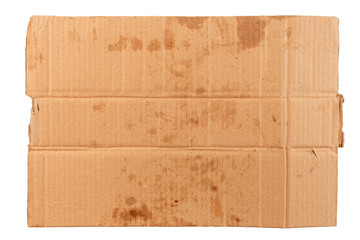 blank flat dirty sheet of yellow cardboard - mockup for homeless placard, isolated on white...