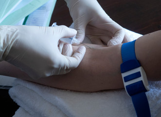 covid-19.  nurse will take a blood sample from a vein for coronavirus testing.