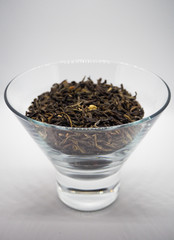 Green tea leaves in a glass