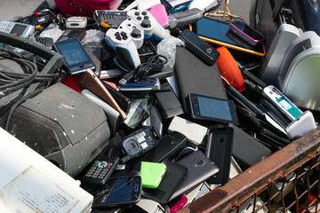 Various types of broken electronic waste at a recycling collection centre