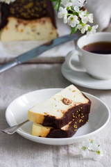 Lviv cheesecake, a traditional Ukrainian dessert with raisins, coated with chocolate icing.