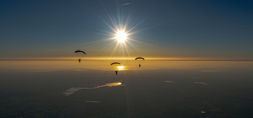 Skydive sunset over the sea