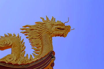 The wooden dragon on the roof, Ho Quoc temple, Vietnam
