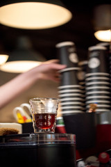 Glass of black filter coffee hario pour over sunlight daylight coffee house cafe