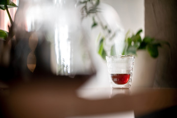 Glass of black filter coffee hario pour over sunlight daylight coffee house cafe