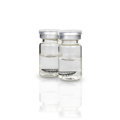 Contact lens in a clear glass bottle isolated on white background. with clipping paths.