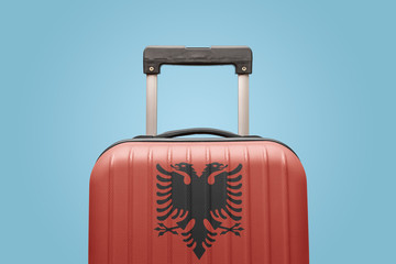 Baggage with Albania flag print tourism and vacation concept.