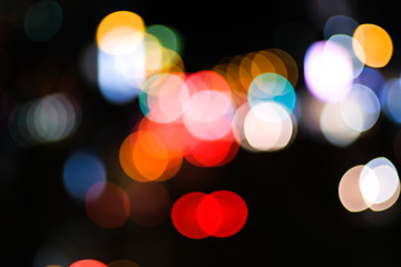 Colorful circle bokeh bright light festival abstract on dark background.