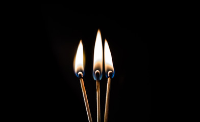 burning matches on a black background