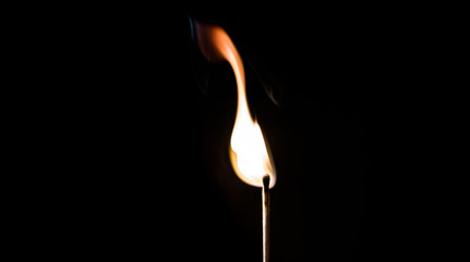 burning matches on a black background