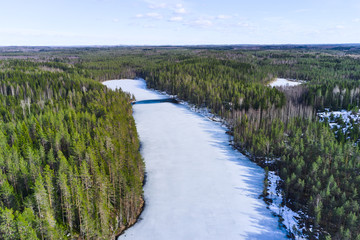 Fototapeta na wymiar Aerial view of ice-covered Kallio lake Finland. North-Karelia nature.