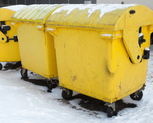 Yellow plastic waste containers