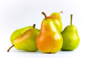 Delicious pears on a wooden tray isolated on a white background