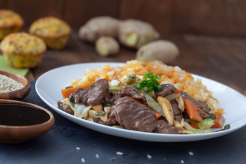 Asian food - roast beef meat with vegetables and rice