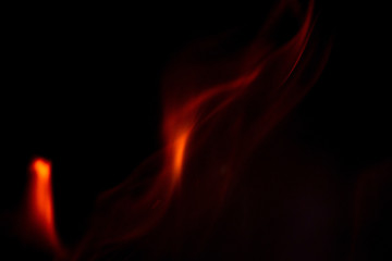 Beautiful fire flame on a black background. Blurry abstraction