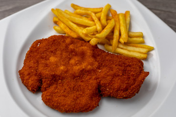 Breaded viennese schnitzel with french fries