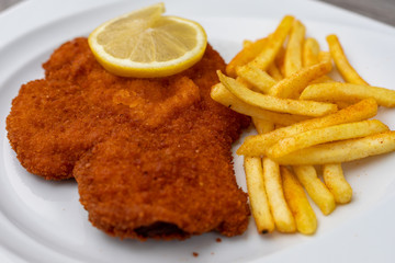 Breaded viennese schnitzel with french fries