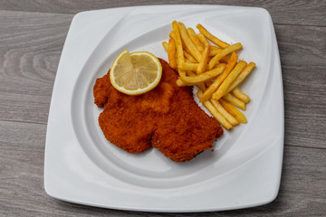 Breaded viennese schnitzel with french fries