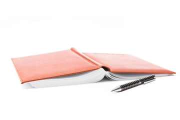 Pen and notebook on a white background, business and education. Isolated
